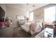 Bedroom featuring mirrored furniture, chandelier, and plush bedding at 2198 Maderno St, Henderson, NV 89044