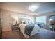 Bright bedroom featuring a modern bed, large mirror, and natural light at 2198 Maderno St, Henderson, NV 89044
