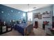 Blue bedroom with star accents, and comic themed decorations at 2198 Maderno St, Henderson, NV 89044