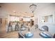 Open concept dining area with stylish decor, chandelier, and adjacent kitchen at 2198 Maderno St, Henderson, NV 89044