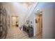 Home entryway featuring decorative art pieces, tile flooring and a staircase leading to the upper level at 2198 Maderno St, Henderson, NV 89044