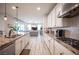 Modern kitchen with island seating, stainless steel appliances, granite countertops and an open floor plan at 2198 Maderno St, Henderson, NV 89044
