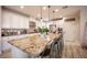 Bright, modern kitchen with granite countertops, stainless steel appliances, and a large center island at 2198 Maderno St, Henderson, NV 89044
