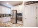 Bright kitchen with granite countertops, stainless steel appliances, white cabinets, and a tile backsplash at 2198 Maderno St, Henderson, NV 89044