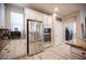 A well-equipped kitchen boasts stainless steel appliances and elegant granite countertops at 2198 Maderno St, Henderson, NV 89044