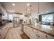 Spacious kitchen with granite countertops, stainless steel appliances and tile floors at 2198 Maderno St, Henderson, NV 89044