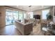 Stylishly furnished living room featuring elegant sofas, chandelier, and a glass coffee table at 2198 Maderno St, Henderson, NV 89044
