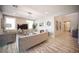 Living room area featuring neutral tones, elegant furniture, chandelier, and tiled flooring at 2198 Maderno St, Henderson, NV 89044
