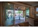View of the outdoor patio with modern furniture, ceiling fan, and beautifully landscaped backyard at 2198 Maderno St, Henderson, NV 89044