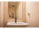 Clean half bath with a square sink and decorative wall art at 2198 Maderno St, Henderson, NV 89044