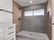 Modern bathroom featuring tiled walk-in shower, sleek fixtures, and vanity with storage at 2368 Winterwood Blvd, Las Vegas, NV 89142