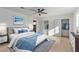 Bright bedroom with plush carpeting, ceiling fan, and spacious closet space at 2368 Winterwood Blvd, Las Vegas, NV 89142