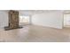 Open living room with a unique stone fireplace and lots of open space at 2368 Winterwood Blvd, Las Vegas, NV 89142