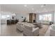 Spacious living room with open floor plan, modern furnishings, and stone fireplace at 2368 Winterwood Blvd, Las Vegas, NV 89142