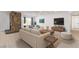 Inviting living room with stone fireplace, modern furnishings, and ample natural light at 2368 Winterwood Blvd, Las Vegas, NV 89142