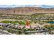 An aerial view shows the property's location within a beautiful community, highlighting the golf course and scenic surroundings at 2539 Turtle Head Peak Dr, Las Vegas, NV 89135