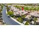 Aerial view of a home showcasing its well-manicured landscaping and proximity to a golf course at 2539 Turtle Head Peak Dr, Las Vegas, NV 89135