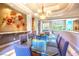 Stylish dining room with modern decor, a glass table, and a view of the backyard at 2539 Turtle Head Peak Dr, Las Vegas, NV 89135