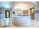 Elegant entryway with marble floors, a curved counter, and an open floor plan at 2539 Turtle Head Peak Dr, Las Vegas, NV 89135