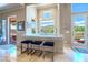 Modern kitchen bar with stylish stools and a scenic view of the surrounding landscape at 2539 Turtle Head Peak Dr, Las Vegas, NV 89135