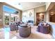 Bright living room with comfortable seating and a fireplace, perfect for relaxation at 2539 Turtle Head Peak Dr, Las Vegas, NV 89135