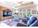 Cozy living room features custom built-ins and a large window showcasing mountain views at 2539 Turtle Head Peak Dr, Las Vegas, NV 89135