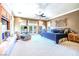 Spacious main bedroom with a sitting area and access to outdoor patio at 2539 Turtle Head Peak Dr, Las Vegas, NV 89135