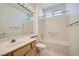 Clean bathroom featuring vanity, a large mirror, tub with shower, and modern fixtures at 2601 Deer Lake St, Las Vegas, NV 89134