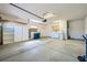 Spacious two car garage featuring built-in shelving and a laundry area at 2601 Deer Lake St, Las Vegas, NV 89134