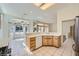Kitchen with stainless steel appliances and tiled flooring, seamlessly connected to the living area at 2601 Deer Lake St, Las Vegas, NV 89134
