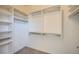 Spacious walk-in closet with built-in shelving and clothing rods for optimal storage at 2601 Deer Lake St, Las Vegas, NV 89134