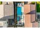Aerial view showcasing a private backyard oasis with pool, jacuzzi, lounge area, and outdoor kitchen at 2710 Marchetti Pl, Henderson, NV 89044