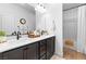 Bright bathroom with dual sinks, modern fixtures, and a shower/tub combo at 2710 Marchetti Pl, Henderson, NV 89044