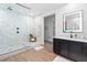 Bright bathroom featuring a large walk-in shower with a glass enclosure and modern fixtures at 2710 Marchetti Pl, Henderson, NV 89044
