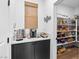 Butler pantry with counterspace and storage solutions adjacent to a generously stocked walk-in pantry at 2710 Marchetti Pl, Henderson, NV 89044