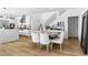 Dining area adjacent to the kitchen and staircase in a modern home at 2710 Marchetti Pl, Henderson, NV 89044