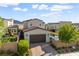 Charming home exterior with a well-manicured lawn, private pool, and attached garage, showcasing curb appeal at 2710 Marchetti Pl, Henderson, NV 89044