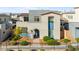 Inviting home with a beautifully landscaped front yard, stone accents, and a cozy, covered entryway at 2710 Marchetti Pl, Henderson, NV 89044