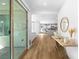 Hallway view towards the kitchen and living areas with wood-look flooring at 2710 Marchetti Pl, Henderson, NV 89044
