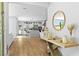 Bright hallway leading to a modern kitchen with stainless steel appliances at 2710 Marchetti Pl, Henderson, NV 89044