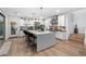 Modern kitchen with a central island, stainless steel appliances, and a seamless transition to the outdoor area at 2710 Marchetti Pl, Henderson, NV 89044