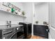 Well-organized laundry room with modern appliances and a practical countertop for folding and sorting at 2710 Marchetti Pl, Henderson, NV 89044