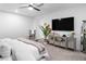 Comfortable main bedroom with dresser and mirror, ceiling fan, and natural light, offering a relaxing retreat at 2710 Marchetti Pl, Henderson, NV 89044