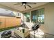 Comfortable covered patio with modern seating, ceiling fan, and outdoor ambiance at 2710 Marchetti Pl, Henderson, NV 89044