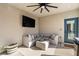 Inviting outdoor patio with comfortable seating, television, and stylish décor, perfect for relaxation and entertaining at 2710 Marchetti Pl, Henderson, NV 89044
