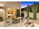 Covered patio with outdoor seating area with a fire pit, ideal for relaxation and outdoor enjoyment at 2710 Marchetti Pl, Henderson, NV 89044