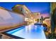 Backyard features a sparkling pool, and an attached spa, perfect for relaxation and entertainment at 2710 Marchetti Pl, Henderson, NV 89044