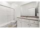Modern bathroom featuring a glass-enclosed shower and stone countertop at 2733 Avril Point St, Las Vegas, NV 89156