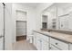 Bathroom with a modern vanity, large mirror, and a closet nearby at 2733 Avril Point St, Las Vegas, NV 89156