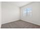 A cozy bedroom features a neutral color palette and soft carpeting at 2733 Avril Point St, Las Vegas, NV 89156
